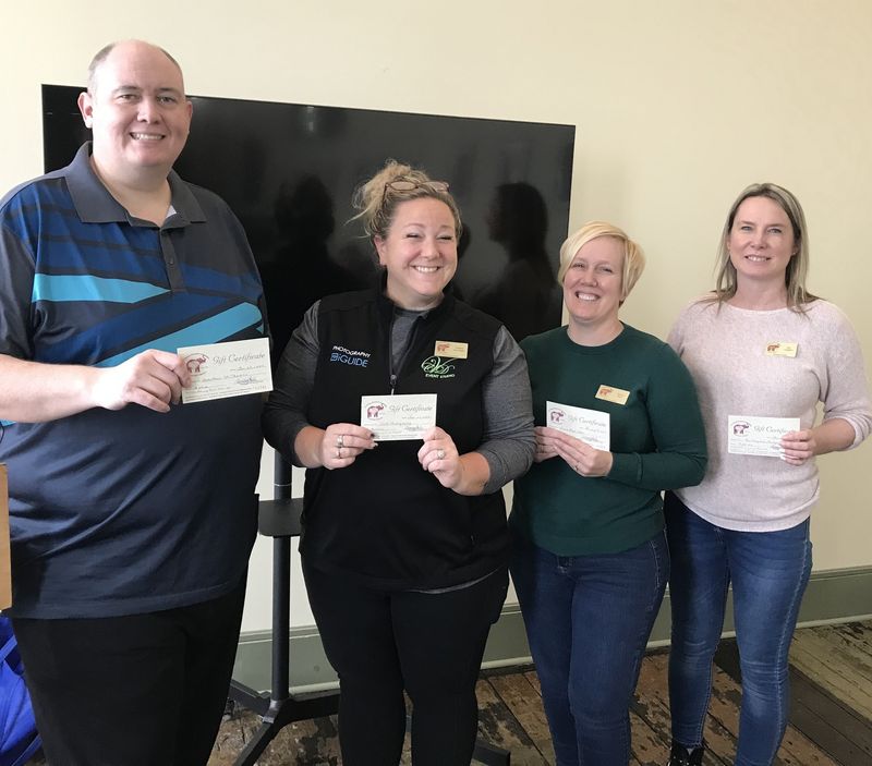 Four members of St. Thomas Executives Association smiling
